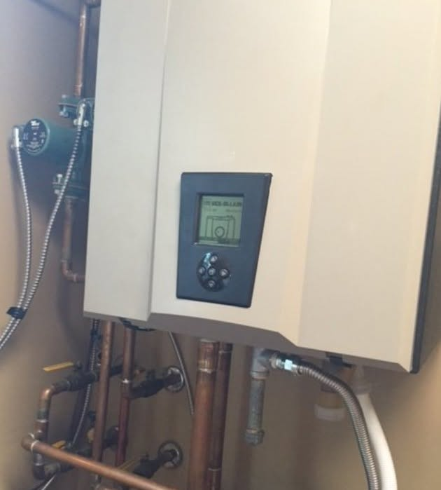 Wall-mounted boiler and copper piping installation