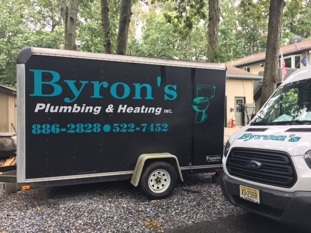 Byron's Plumbing and Heating service trailer and van